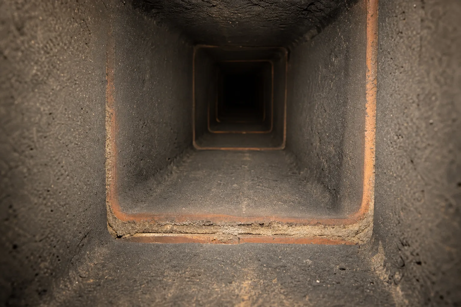 clay flue liner in sound condition with tight mortar joints between stacked tile sections