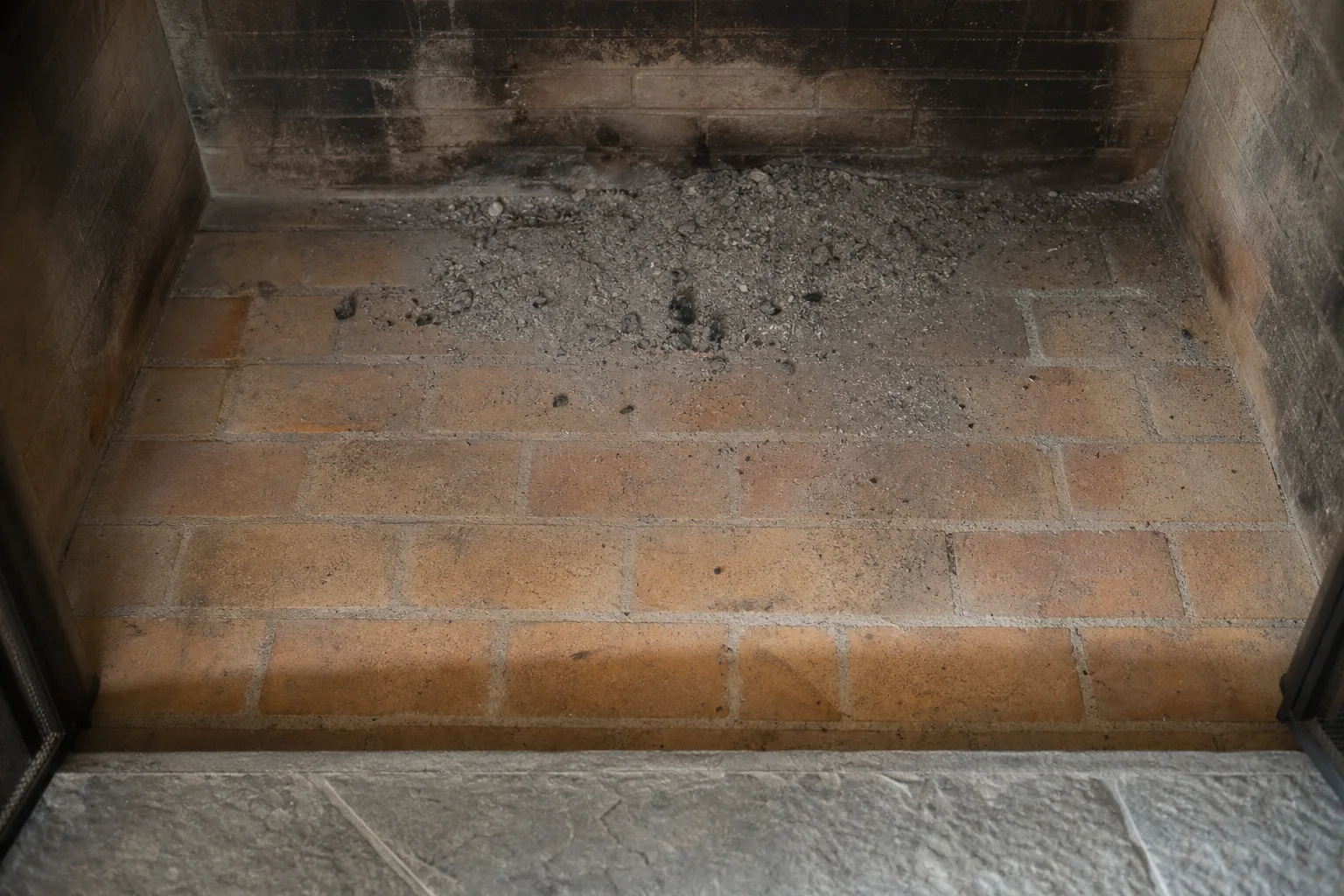 What is the bottom of a fireplace called inside the opening: firebrick firebox floor seen from above