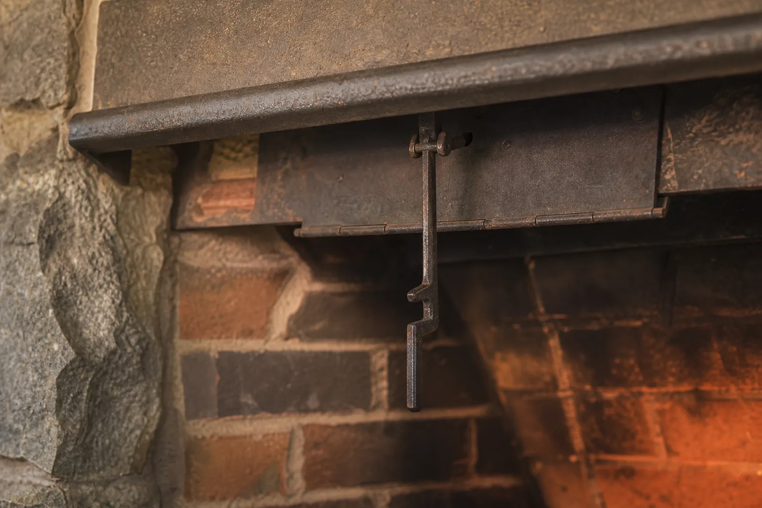 Chimney damper handle mechanism, the notched lever that swings the cast iron plate