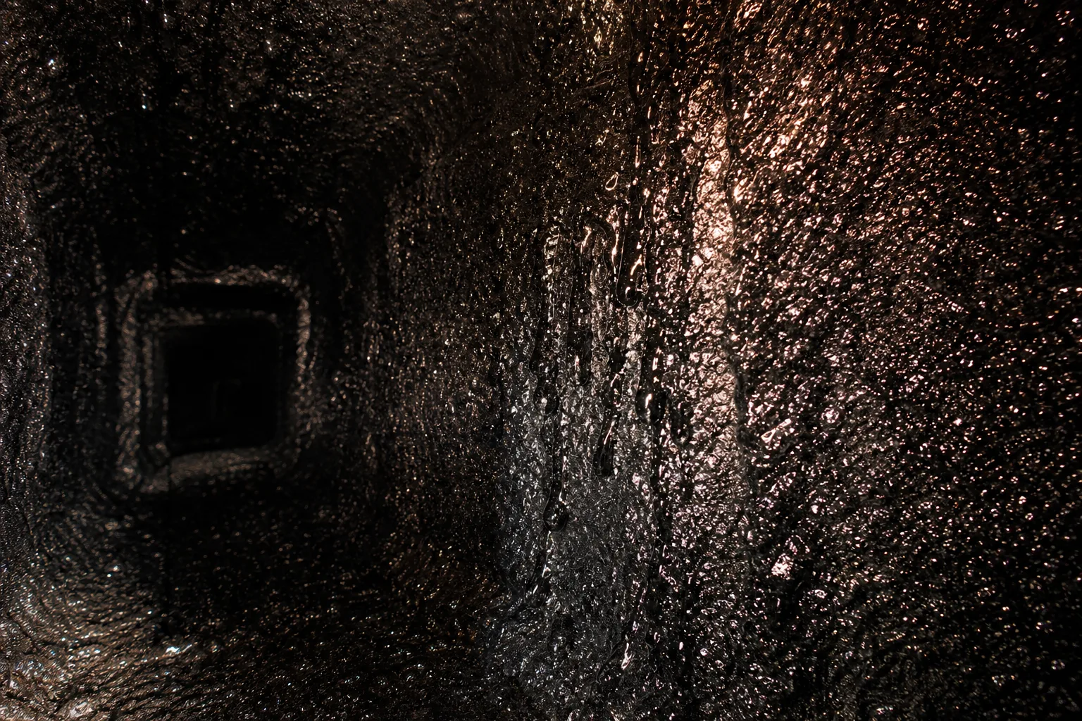 creosote stages: stage 3 glazed creosote as a hard shiny black coating inside a flue