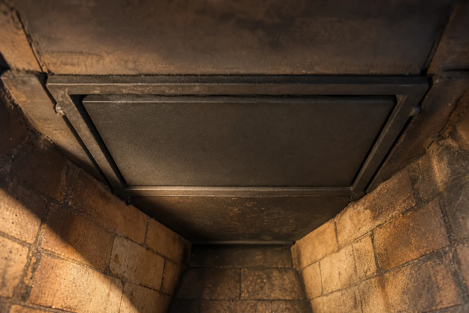 Chimney dampers in typical sound condition, a flat throat damper plate seated evenly in its frame