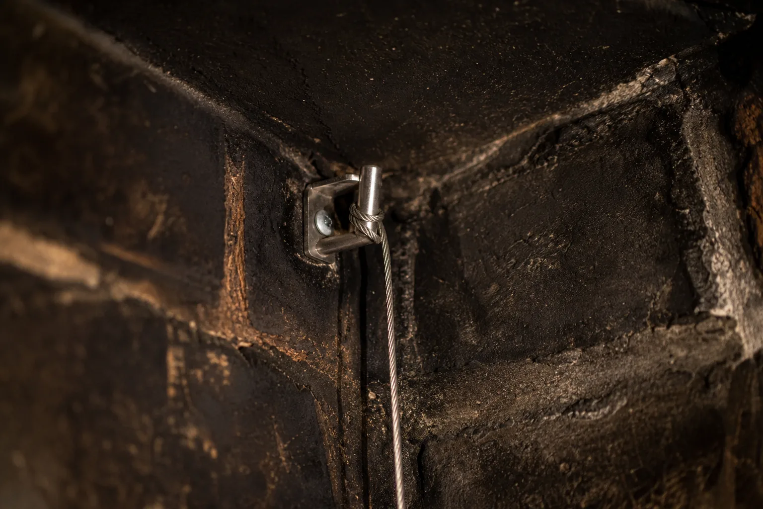 Chimney dampers operated by cable, the stainless cleat and cable anchored inside a sooted firebox