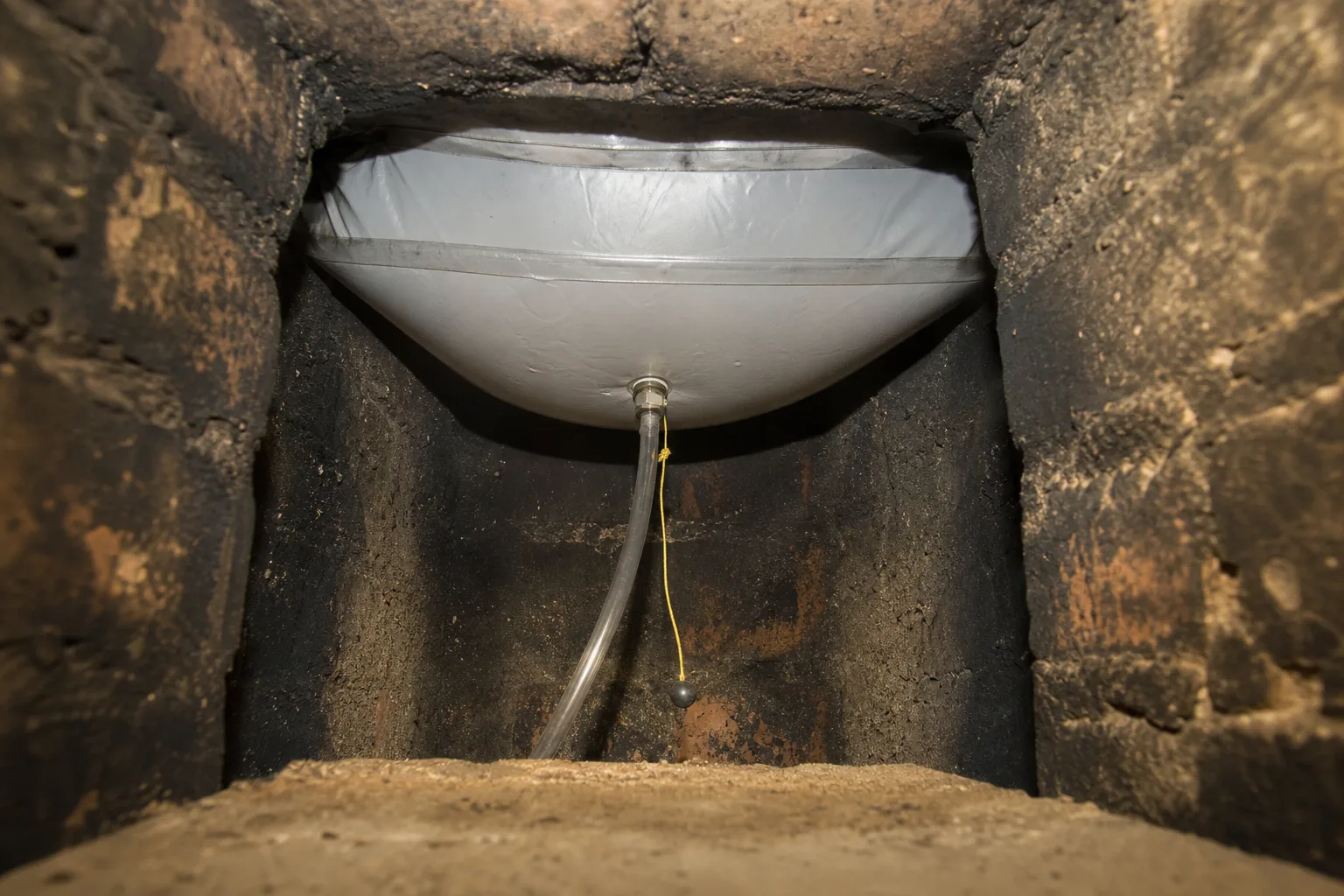 chimney balloon seated and inflated in the flue above the damper